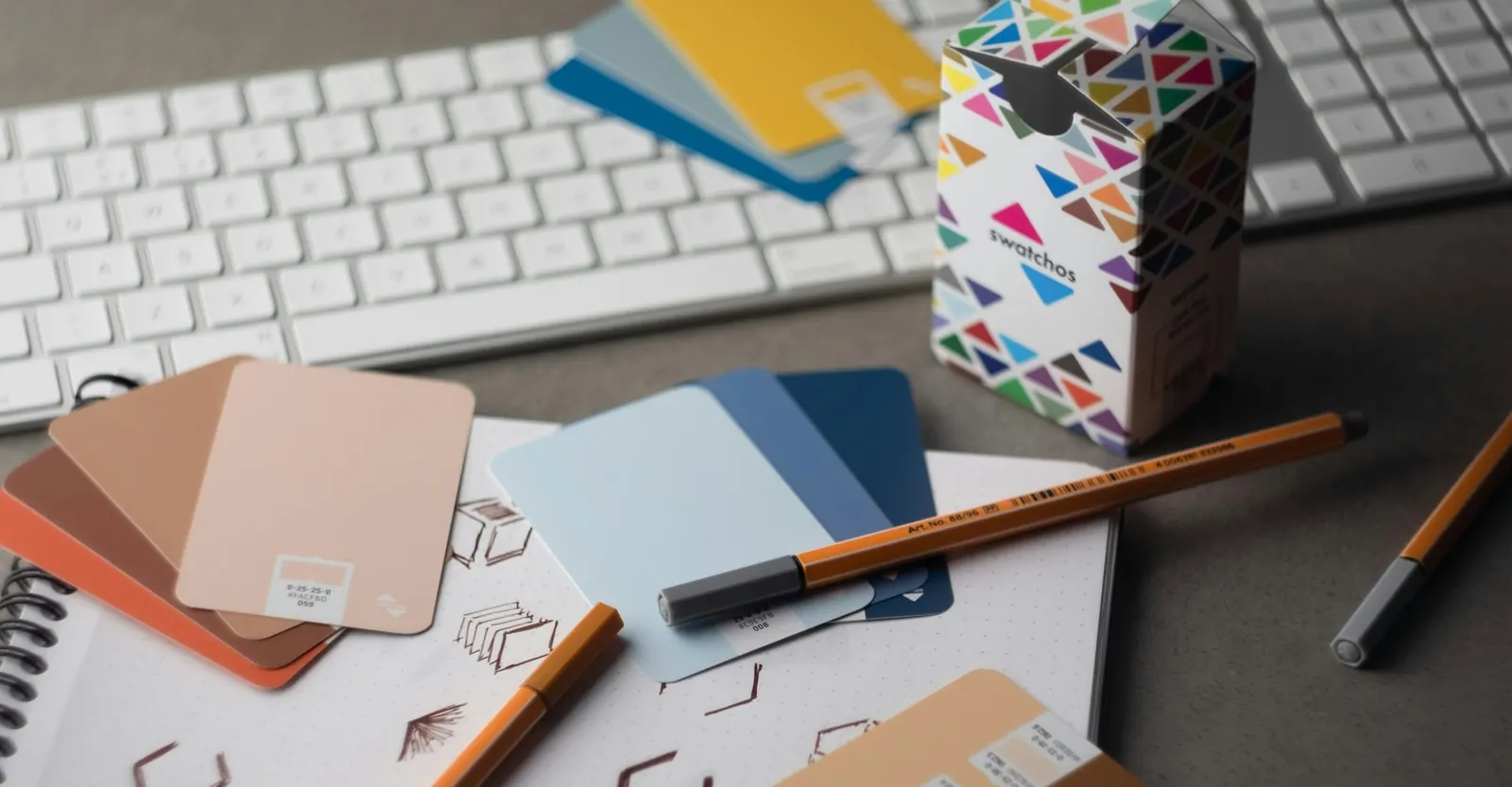 Designer desk with colour swatches and pencils