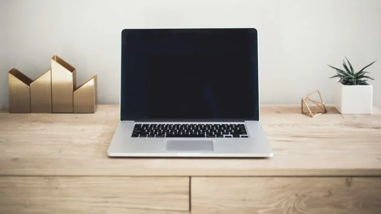 Laptop on a wooden table
